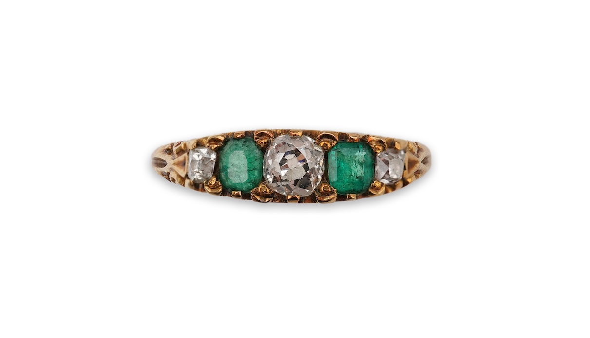 An emerald and diamond five-stone ring, circa 1900